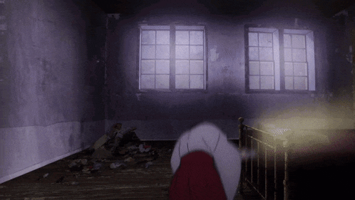 a dark room with a few windows and a person in a red dress
