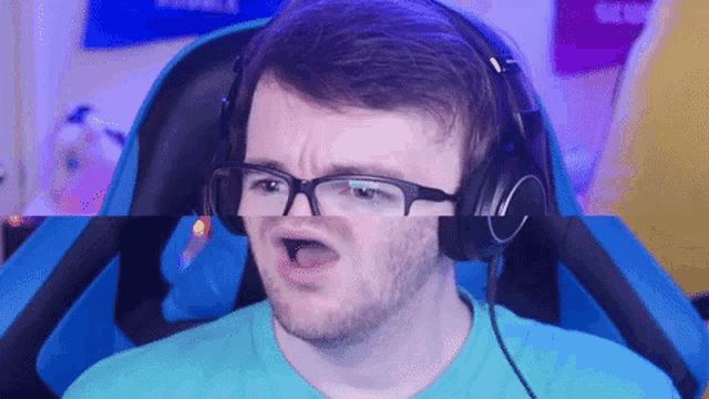 a man wearing glasses and headphones makes a funny face