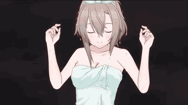a girl wrapped in a white towel is standing with her arms outstretched .