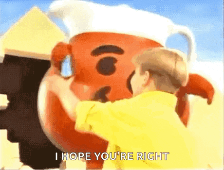 a child is hugging a large kettle corn mascot .