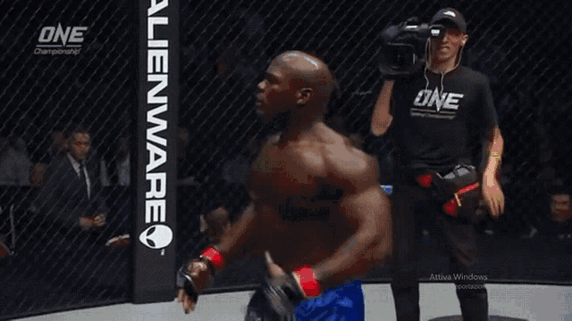 a man in a boxing ring with one championship written on the corner