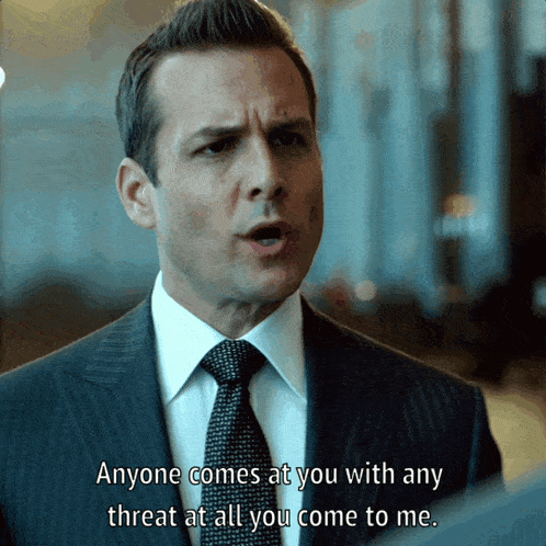a man in a suit and tie says that anyone comes at you with any threat at all you come to me