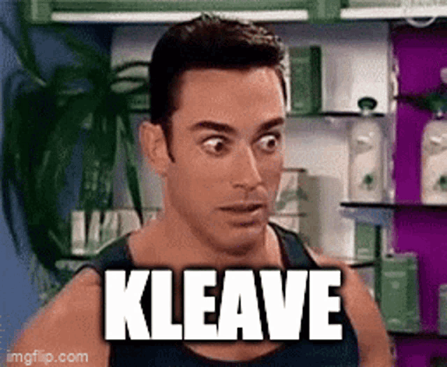 a man is making a funny face and the word kleave is on his chest .