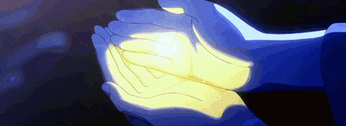 a person holding something in their hands that is glowing