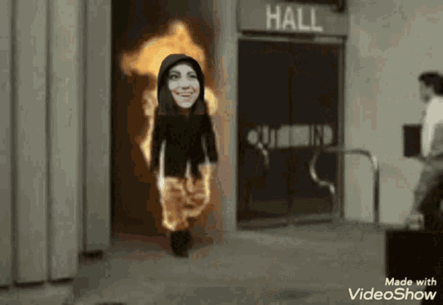 a video showing a woman walking through a hallway