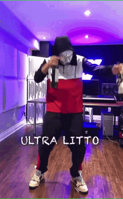 a man wearing a mask is dancing in a room with the words ultra litto on the bottom right
