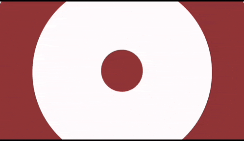 a white circle with a red circle in the middle of it