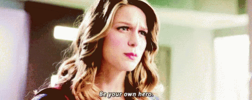 a close up of a woman 's face with the words `` be your own hero '' .