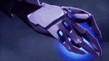 a close up of a robotic hand with a blue light coming from it