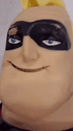 a close up of a superhero statue with its mouth open