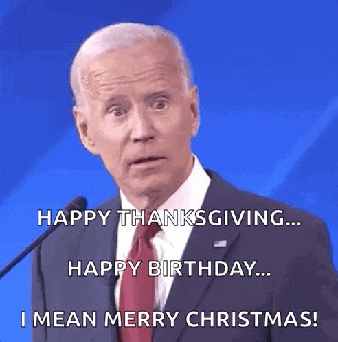a man in a suit and tie says happy thanksgiving happy birthday and i mean merry christmas