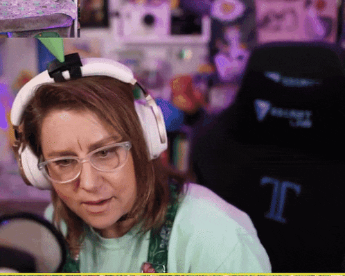 a woman wearing headphones and a shirt that says velvet cat