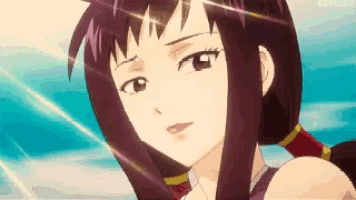 a close up of a woman 's face with a blue sky in the background .