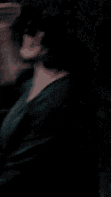 a blurry picture of a person 's face with a shadow on the floor