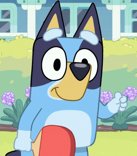 a cartoon dog is holding a red object in his paw