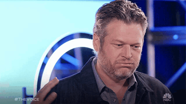 a man with a beard is on a nbc show
