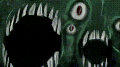 a close up of a monster 's mouth with sharp teeth and red eyes