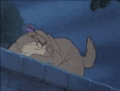 a cartoon dog is laying on a brick wall in the rain .