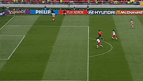 a soccer game is being played in front of a banner that says x fuerox