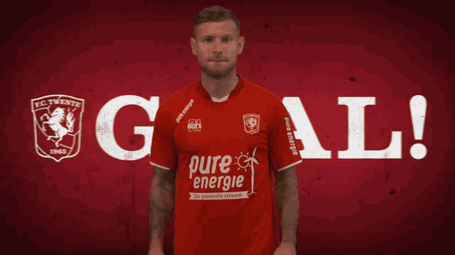 a man in a red shirt with pure energie on it