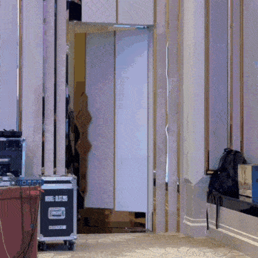 a model blast 245 is on a rolling case in a room