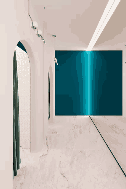 a hallway with a blue wall and a mirror