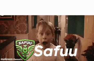 a little boy is making a funny face in front of a sign that says safuu