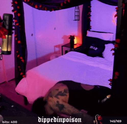 a person is laying on a bed with a purple canopy and the words dipped inpoison on the bottom