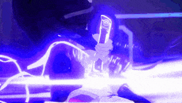 a person is holding a cell phone in their hand in a dark room