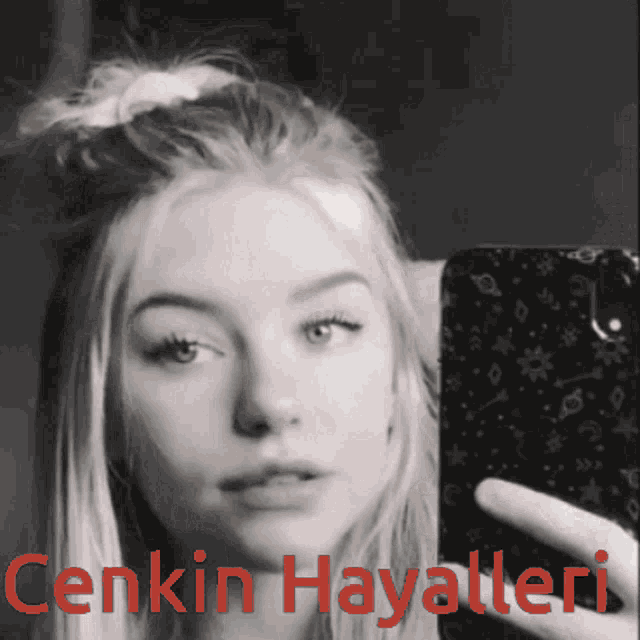 a woman taking a selfie with the words cenkin hayalleri written below her