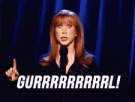 a woman is giving the middle finger and saying gurr