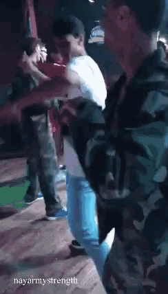 a group of people are dancing in a room with the words nayarmystrength written on the bottom