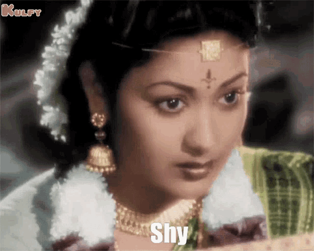 a close up of a woman 's face with the word shy on the bottom