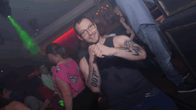 a man with a tattoo on his arm that reads 007
