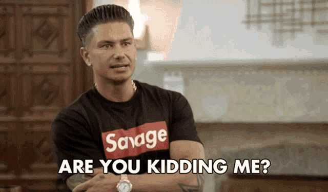 a man wearing a savage t-shirt is asking if he is kidding