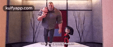 a man and a woman are standing next to each other in a room and talking .