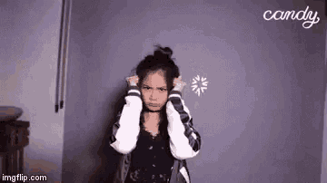 a young girl is making a funny face in front of a loading screen .