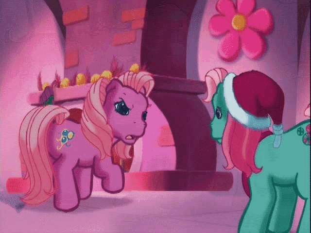 two ponies are standing next to each other in a room