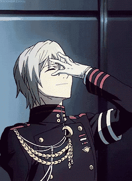 a man in a military uniform is covering his eyes