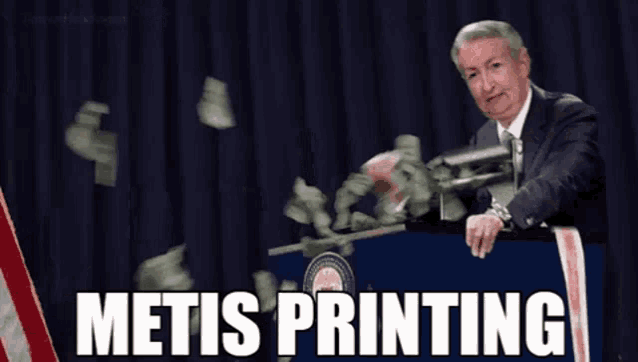 a man is standing at a podium with money falling around him and the words metis printing written on the podium