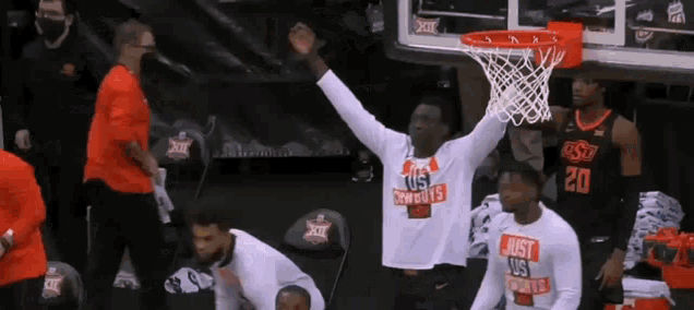 a basketball player wears a shirt that says just us