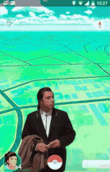 a man in a suit is holding a pokeball in a game