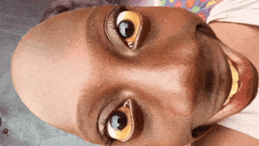 a close up of a person 's face with a smile on it