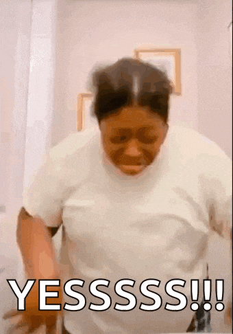 a woman in a white shirt is standing in a bathroom with the words yesssss !