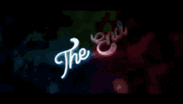 a neon sign that says " the end " on a colorful background
