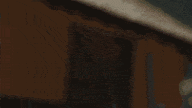 a blurred image of a person 's hands reaching out towards the camera