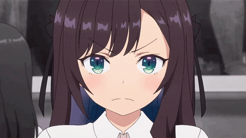 a girl with long brown hair and green eyes has a serious look on her face