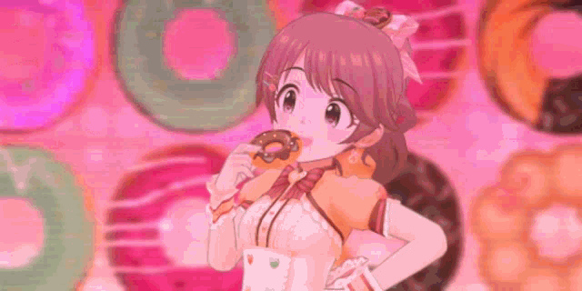 a girl is eating a donut in front of a bunch of donuts .