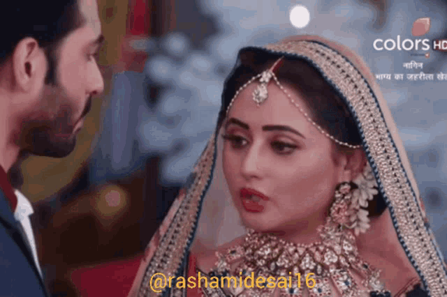 a bride and groom are looking at each other and the bride is wearing a veil
