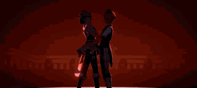 a man and a woman are standing next to each other in front of a red heart .